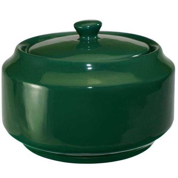 A green ceramic pot with a lid.