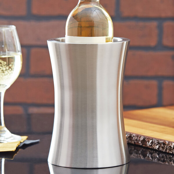An American Metalcraft stainless steel hourglass shape wine cooler holding a wine bottle.