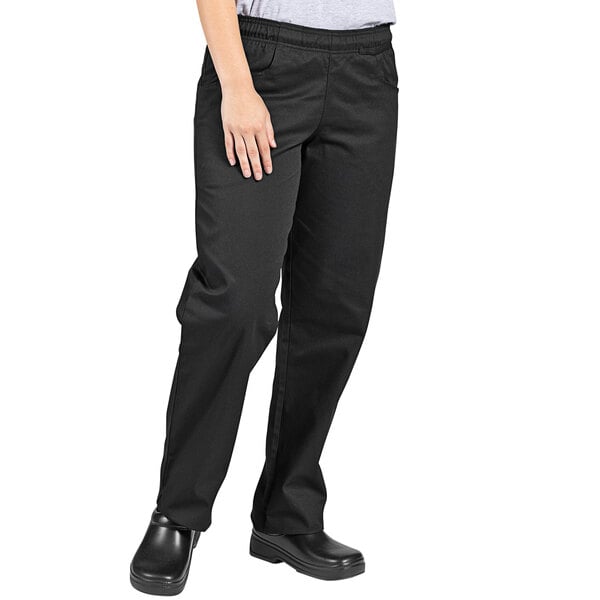 A woman wearing Uncommon Chef black chef pants.