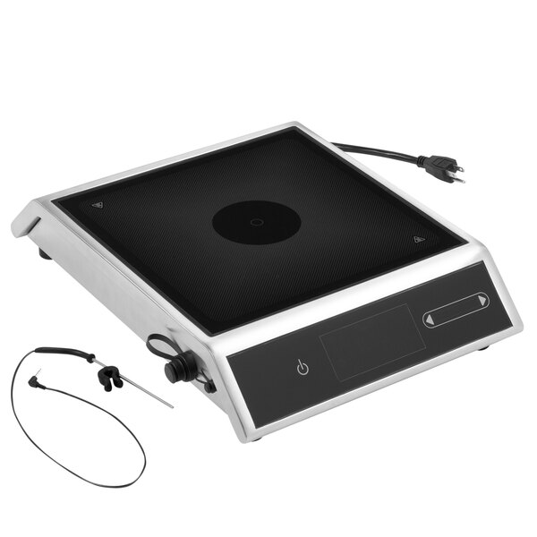 A black and white Vollrath electronic countertop induction range with a cord.