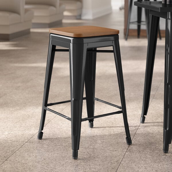 Lancaster Table & Seating Alloy Series Black Indoor Backless Counter Height Stool with Walnut Wood Seat