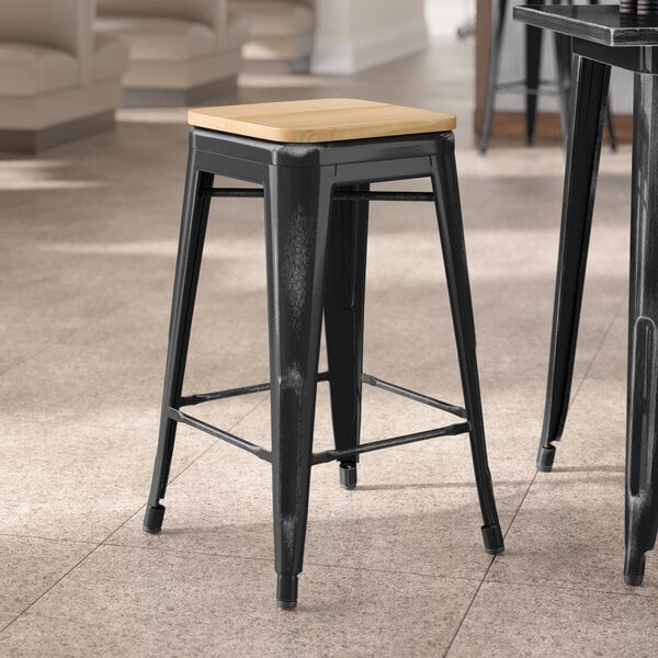 Lancaster Table & Seating Alloy Series Distressed Black Indoor Backless Counter Height Stool with Natural Wood Seat