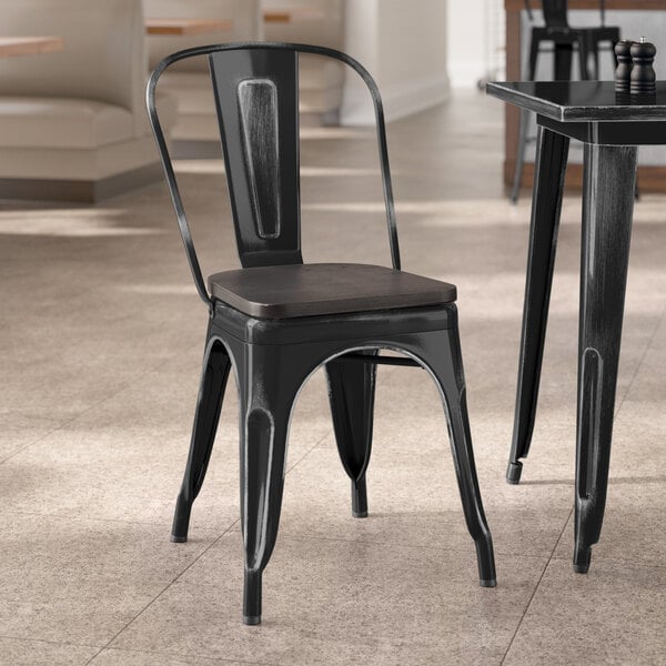 Lancaster Table & Seating Alloy Series Distressed Black Indoor Cafe Chair with Black Wood Seat