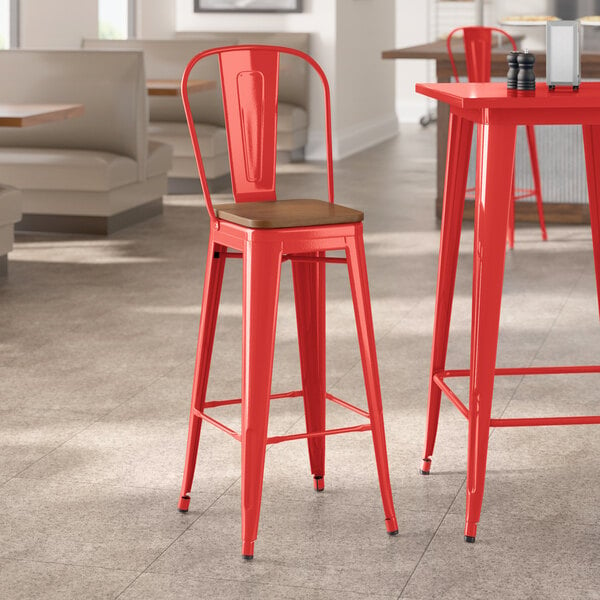 Lancaster Table & Seating Alloy Series Ruby Red Indoor Cafe Barstool with Walnut Wood Seat
