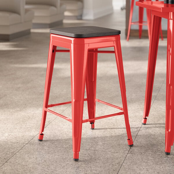Lancaster Table & Seating Alloy Series Ruby Red Indoor Backless Counter Height Stool with Black Wood Seat