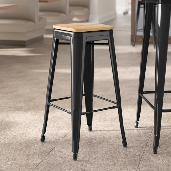 Lancaster Table & Seating Alloy Series Black Indoor Backless Barstool with Natural Wood Seat