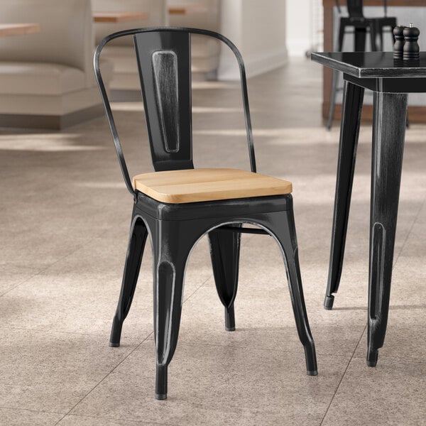 Lancaster Table & Seating Alloy Series Distressed Black Indoor Cafe Chair with Natural Wood Seat