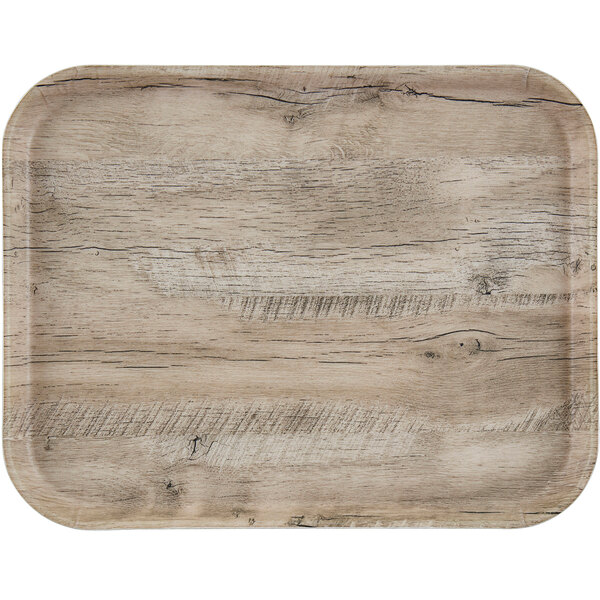 A Cambro light olive fiberglass tray with a wood grain surface and white border.