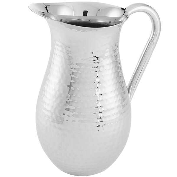 An American Metalcraft stainless steel pitcher with a hammered finish and a handle.