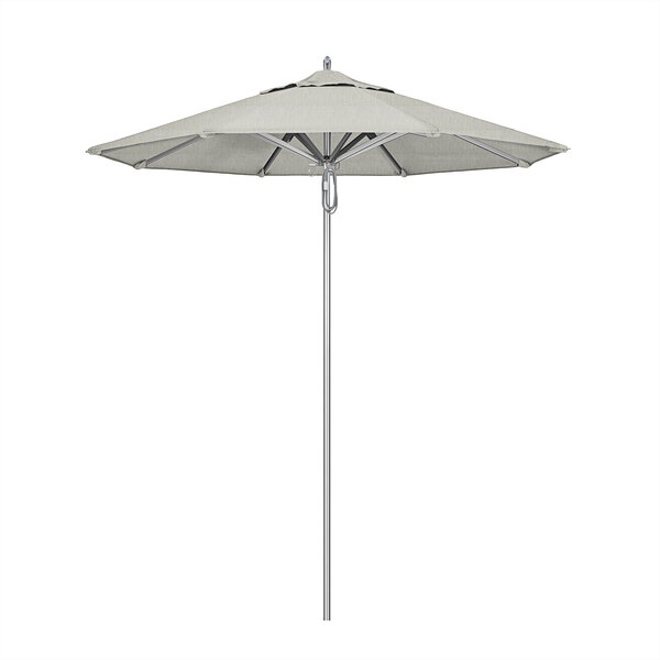 A California Umbrella with a Sunbrella Granite canopy on a metal pole.