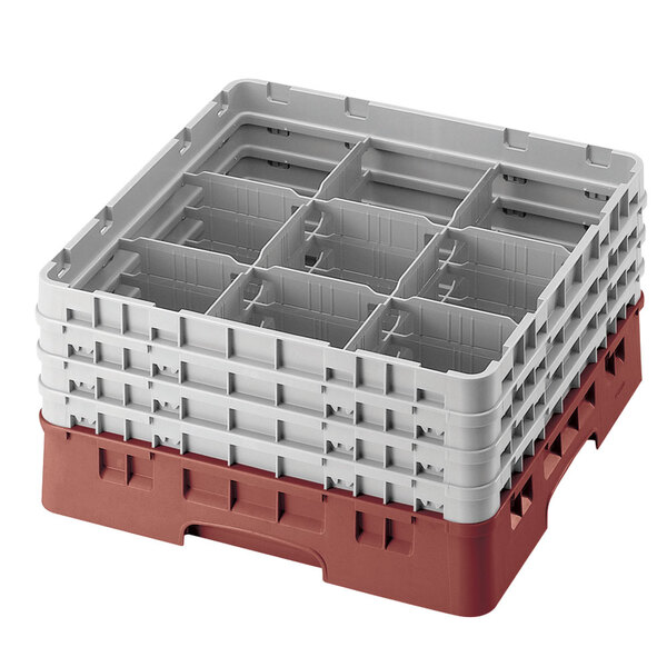A red and white plastic Cambro glass rack with extenders.