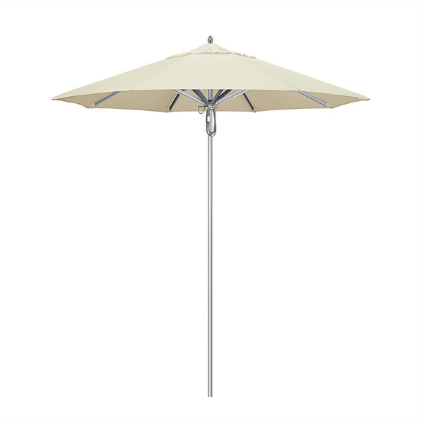 A white California Umbrella with a Sunbrella canopy on a metal pole.