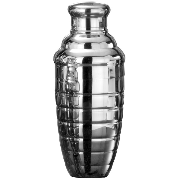 An American Metalcraft stainless steel beehive cocktail shaker on a table.