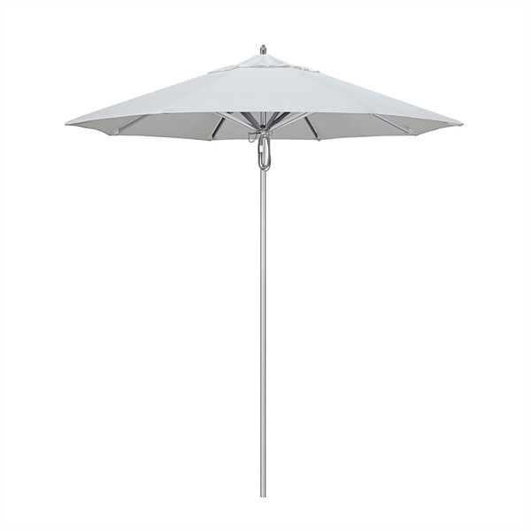 A California Umbrella with a Sunbrella Natural fabric canopy on an aluminum pole.