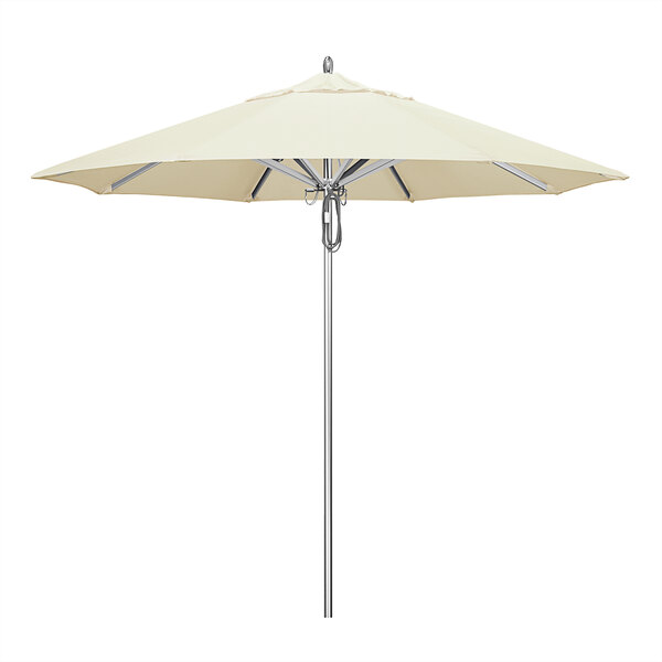 A California Umbrella with Sunbrella Canvas Fabric on a white pole.