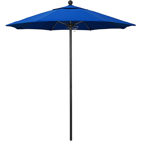 A royal blue California Umbrella on a black pole.