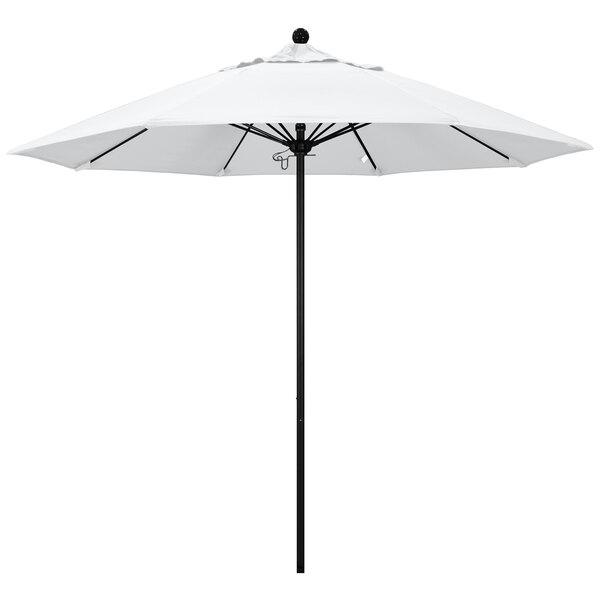 A white California Umbrella on a pole.