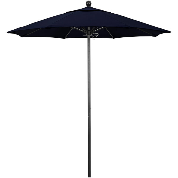 A navy blue California Umbrella with a black pole.