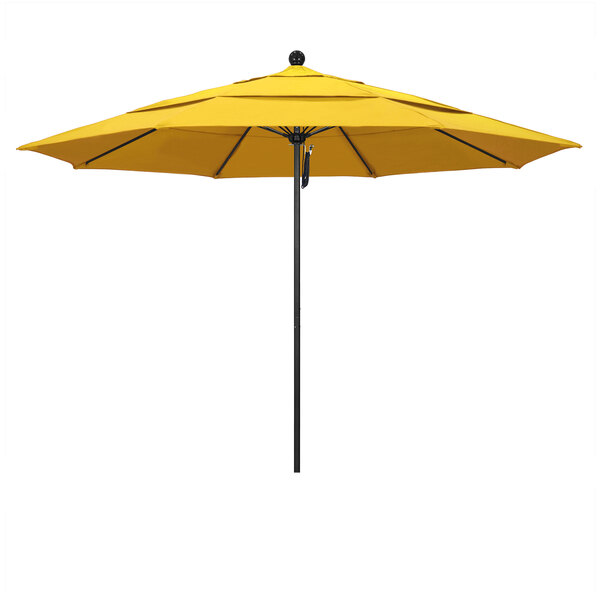 A California Umbrella lemon yellow umbrella on a black pole.