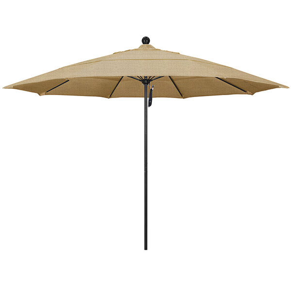 A tan California Umbrella on a black pole.