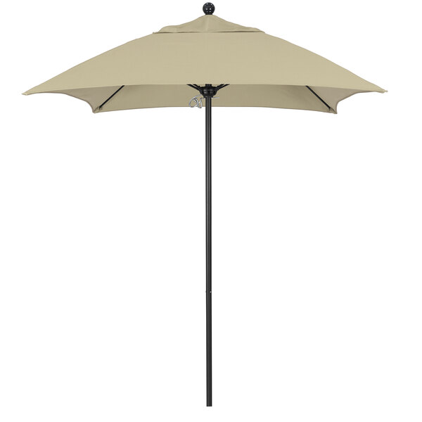 A tan California Umbrella with a black pole.