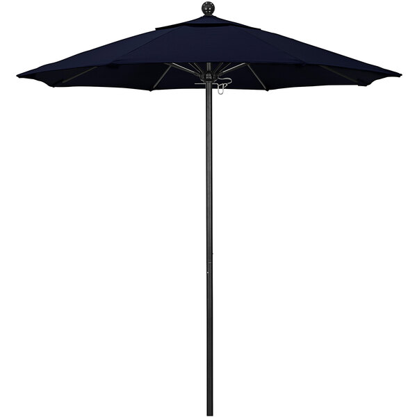 A navy California Umbrella on a black pole.