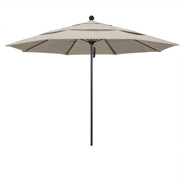 A close-up of a California Umbrella ALTO Olefin Venture umbrella with a black pole.