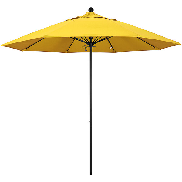 A close up of a yellow California Umbrella with a black pole.