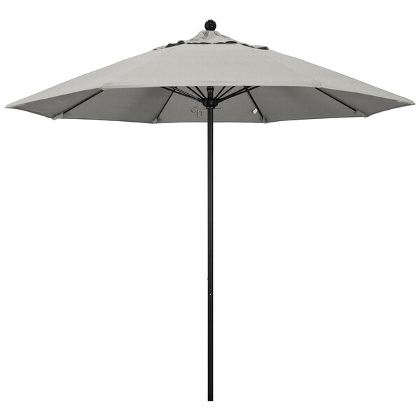 A grey California Umbrella with a Sunbrella granite canopy on a pole.