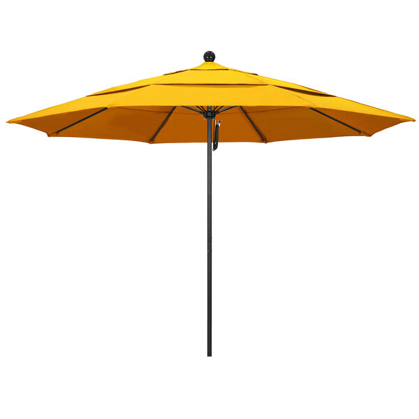 A yellow California Umbrella on a black pole.