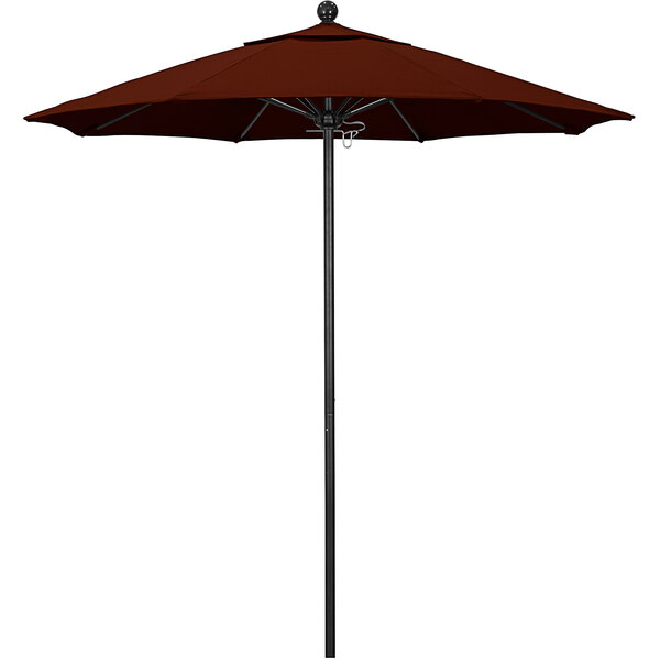 A brown California Umbrella with a black pole on a black pole.