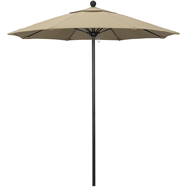 A California Umbrella with a beige Pacifica canopy on a black aluminum pole.