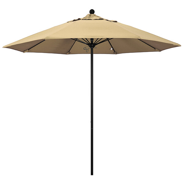 A tan California Umbrella on a black pole.