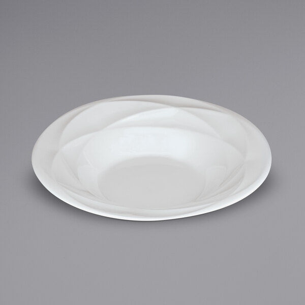 A Sant'Andrea Pensato bright white porcelain bowl with an embossed circular design.