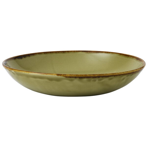A close-up of a Dudson Harvest green coupe bowl with brown edges.