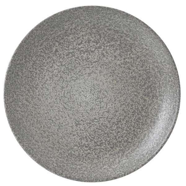 A close-up of a Dudson Evo Origins natural grey coupe plate with a speckled surface.