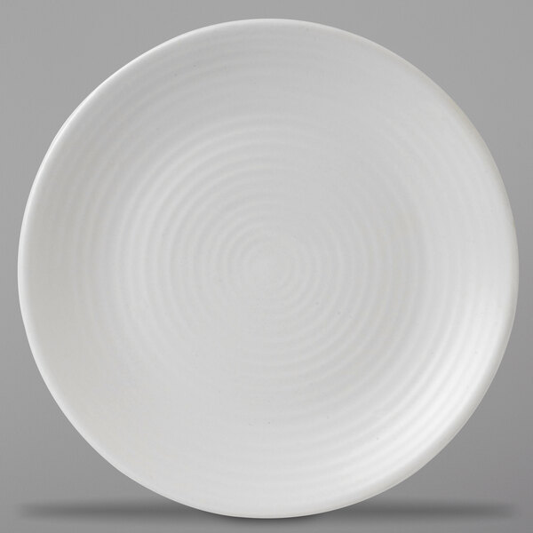 A Dudson Matte Pearl stoneware plate with a spiral pattern.