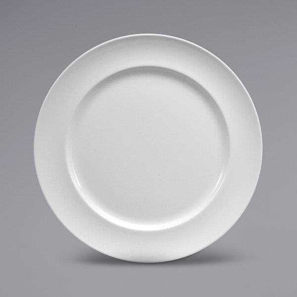 A close-up of a Sant'Andrea Cromwell warm white porcelain plate with a round edge.