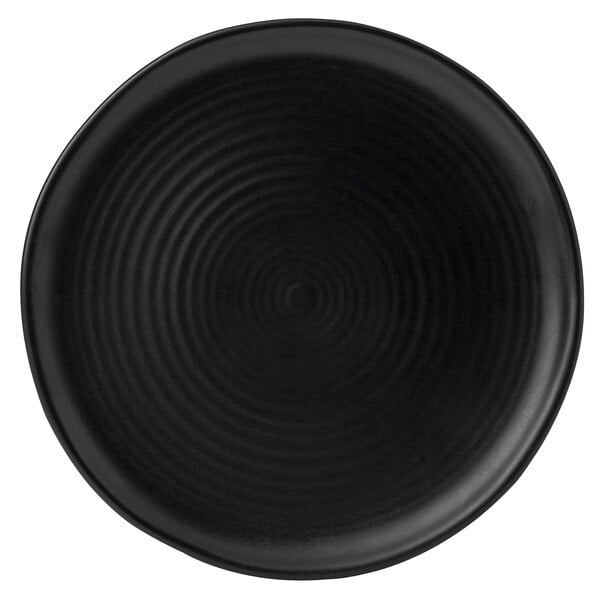 A black Dudson Evo stoneware plate with a spiral pattern in the middle.