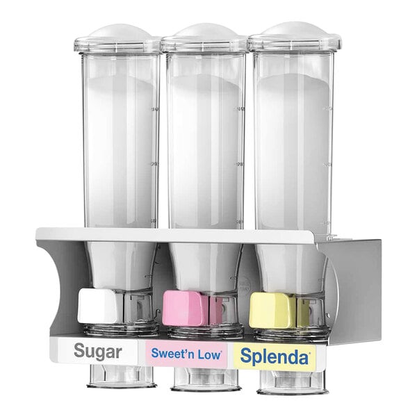 A white SweetStation triple sweetener dispenser with black borders and silver handles containing three different colored sweeteners.