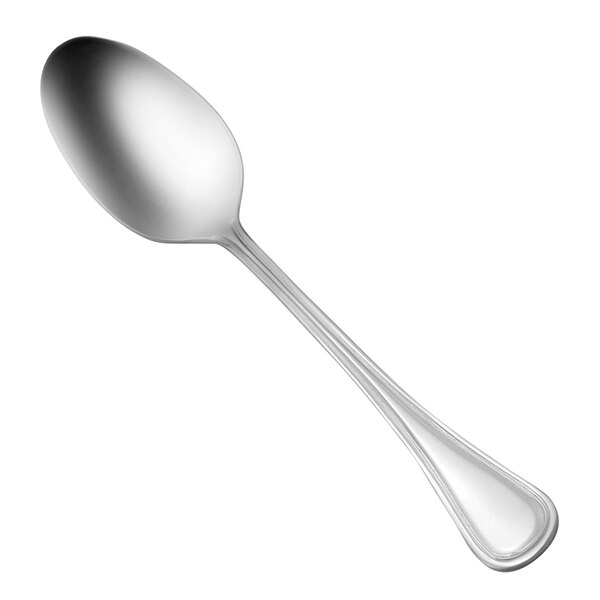 The oval bowl of a Oneida Barcelona stainless steel spoon with a silver handle.