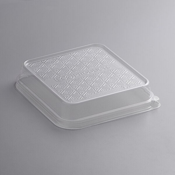A clear Eco-Products WorldView compostable plastic lid on a white plastic container.