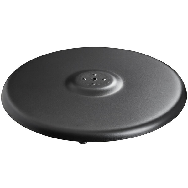 A black circular base plate for a Lancaster Table & Seating outdoor table base with a hole in the middle.