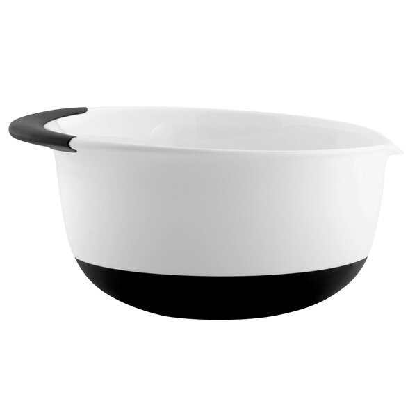 An OXO white plastic mixing bowl with a black non-slip base and handle.