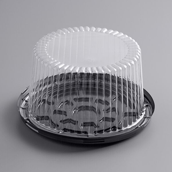 A Choice plastic cake container with a clear lid.