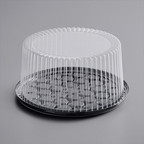 A Choice plastic container with a clear dome lid for cake.