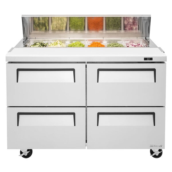 A white Turbo Air refrigerated sandwich prep table with four drawers and two doors.
