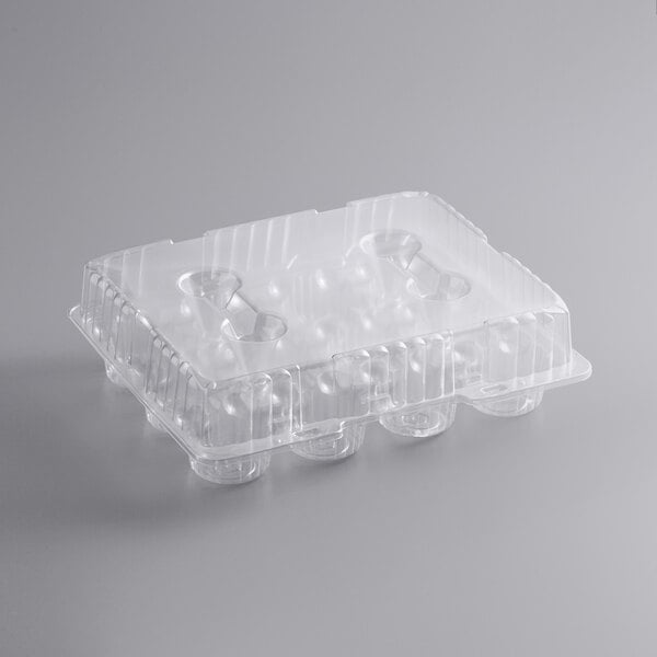 A clear plastic container with a hinged lid and 12 cups.