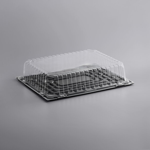 A clear plastic Choice sheet cake container with a clear lid on a counter.
