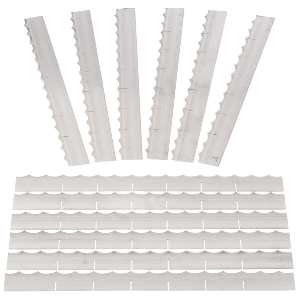 A group of white plastic strips with different sizes.